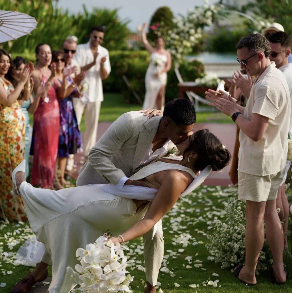 Romantic dip kiss during Jess and Ameer's wedding.